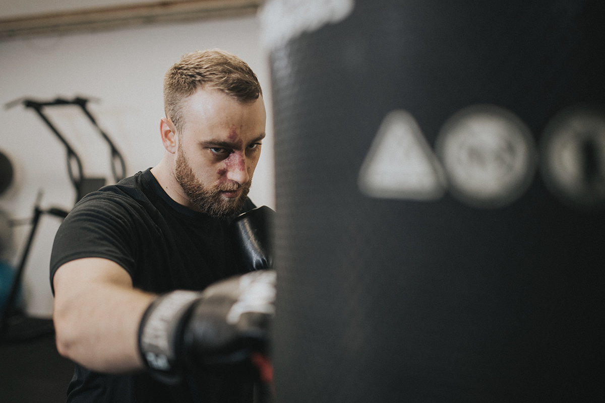 Man boxing in gym