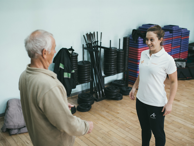 Physio demonstrates good posture to a patient