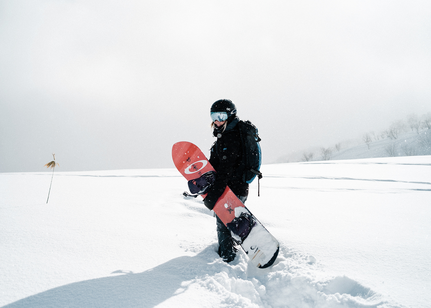 Female snowboarder wearing a helmet