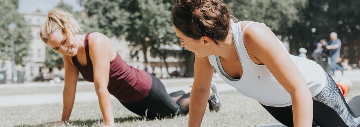 Two females exercising in the park