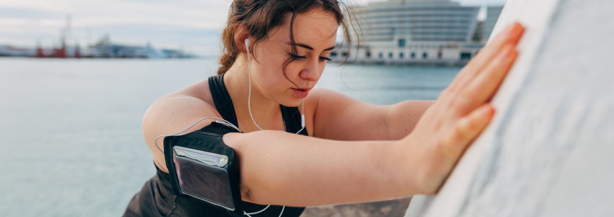 Woman stretching during run