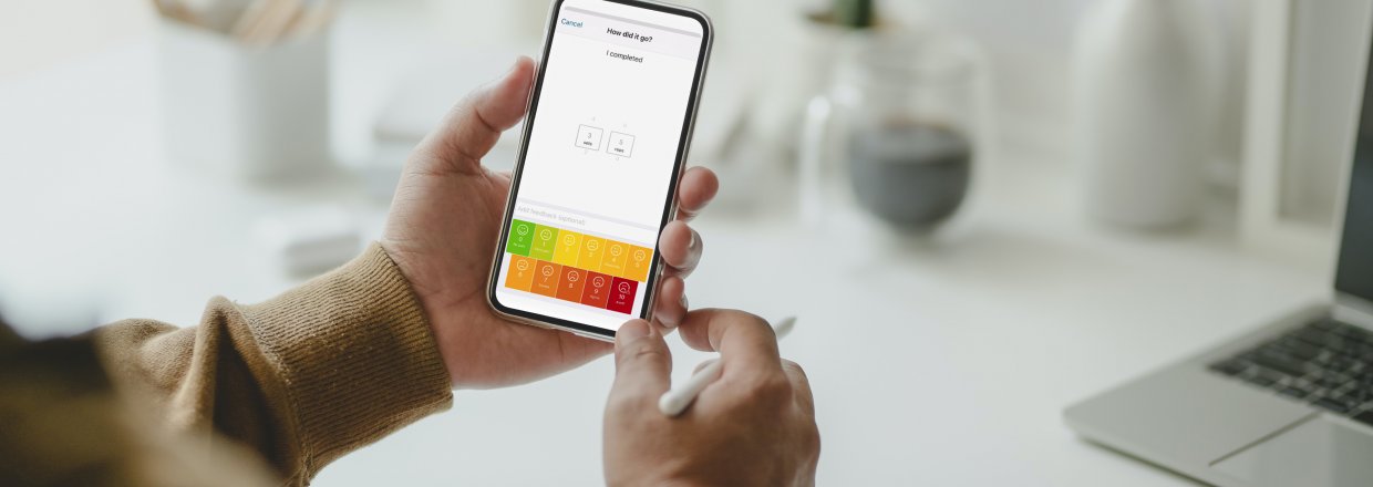 Person rating pain levels through the Ascenti Physio app