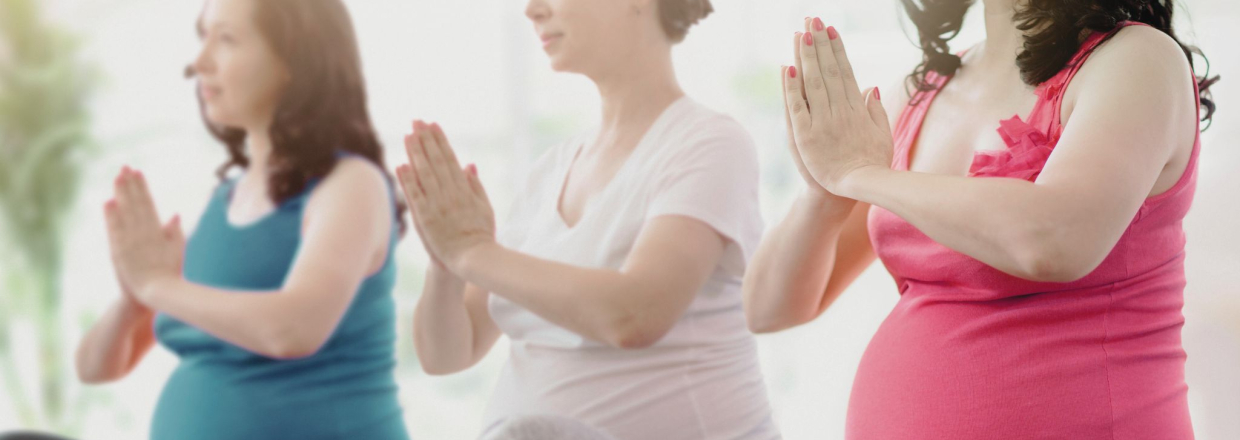 Pregnant women doing yoga