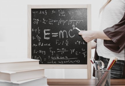 Image of a chalk board with mathematical equations on it