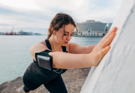 Woman stretching during run